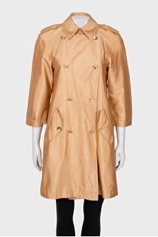 Double-breasted orange raincoat