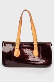 Bag from varnish leather in a corporate print