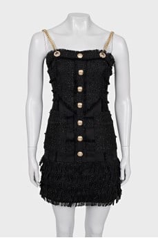 Dress with golden straps and fringe