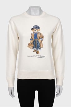 White sweatshirt with branded print and tag