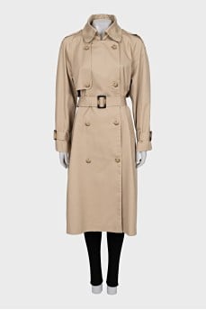 Beige trench coat with buckles