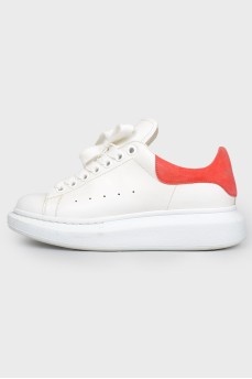 Sneakers on lacing with a red suede heel