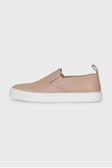 Leather slip-ons with gold-tone decor