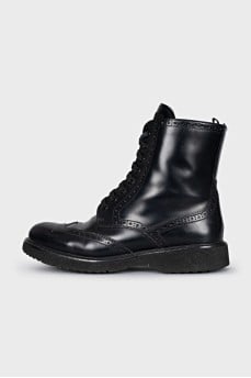 Leather boots with a zipper and perforations