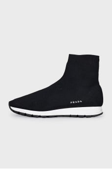 Black textile sneakers with a white sole