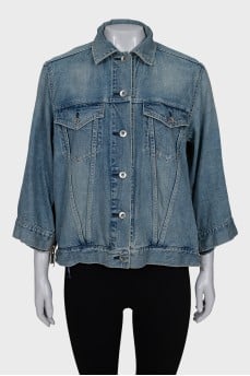 Denim jacket decorated with zippers