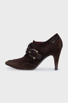 Suede ankle boots with a gold buckle