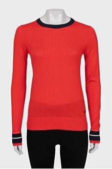 Red jumper with brand logo