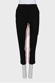 Trousers with pink stripes