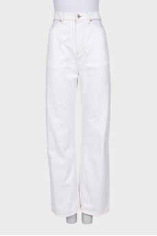 White jeans with cutouts at the waist