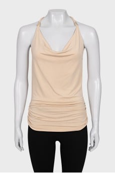 Top with gold-colored decor on straps