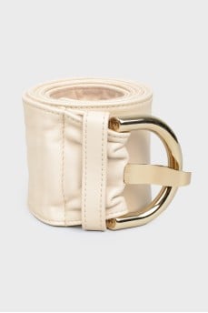 Leather belt with buckle and needle