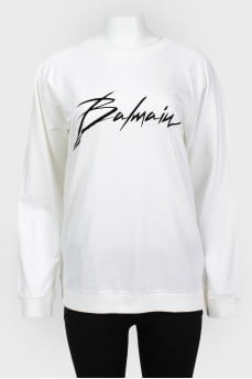Men's sweatshirt with a black logo with a tag
