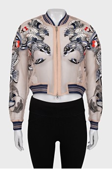 Transparent bomber jacket decorated with embroidery