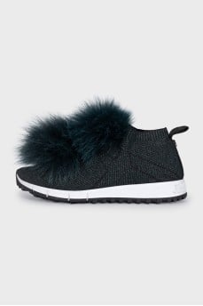 Textile sneakers decorated with fur