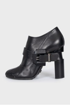 Leather ankle boots with heels and buckles