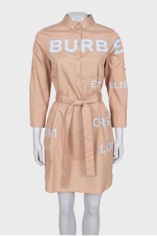 Dress with a buttoned patch pocket