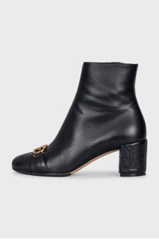 Black leather ankle boots with gold hardware