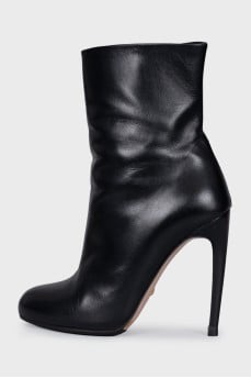Black ankle boots with a curved heel