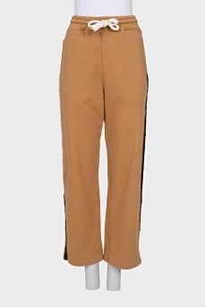 Yellow trousers with voluminous seams