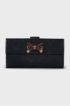 Fabric wallet with a branded monogram