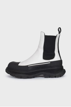 Black and white leather boots with elastic bands