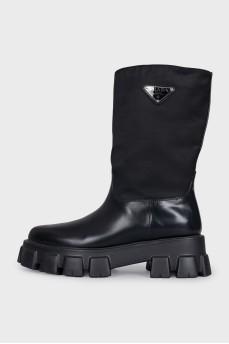 Black boots with silver logo