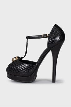 Black leather sandals with gold decor