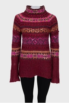 Long sweater decorated with sequins