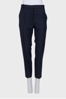 Tapered blue trousers with creases
