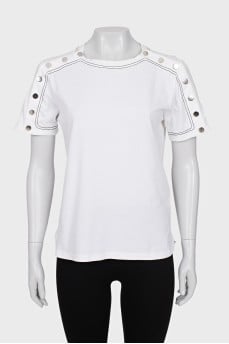 White T-shirt decorated with buttons