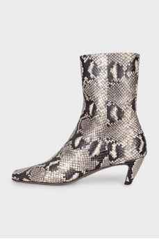 Ankle boots with embossed detailing and a beveled heel
