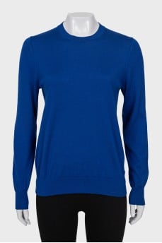 Blue jumper with patches on the sleeves