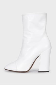 White leather ankle boots with a stable heel
