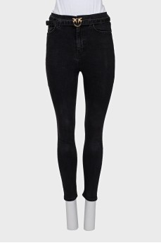 Skinny jeans with a gold buckle