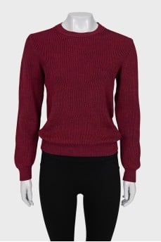 Red sweater with a tag