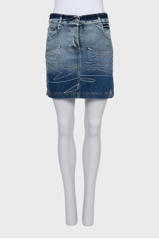 Denim mini skirt with buttons and decoration