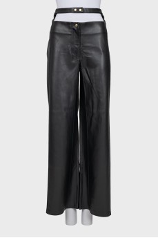 Faux leather trousers with a cutout