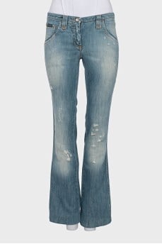 Light blue flared jeans with distressing