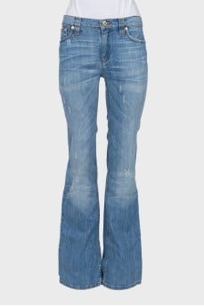 Flared denim with embellished pockets