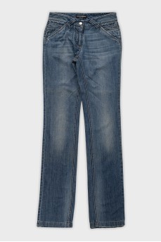 Low-rise straight leg jeans with distressing