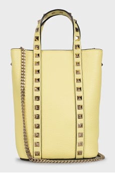 Yellow leather bag with studs