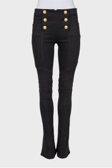 Black flared jeans with gold buttons