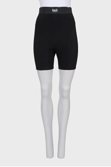 Black shorts with raised seams and tag
