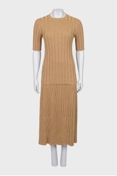 A top and skirt suit with gold thread