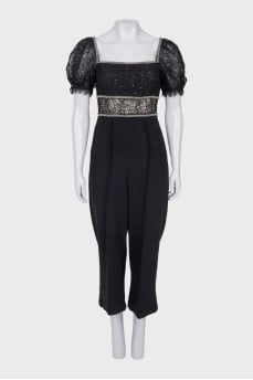 Jumpsuit with openwork sleeves decorated with crystals