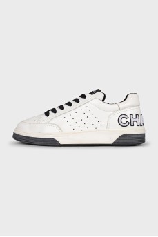White sneakers with embroidery on the back