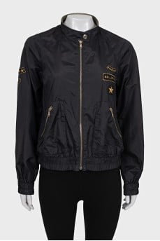 Jacket with a zipper and a patch