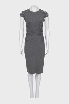A fitted dress decorated with lace