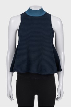Sleeveless top with a high collar